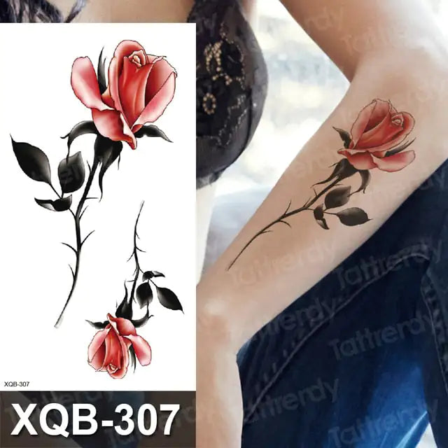 Colorful Flowers Among Other Tattoos